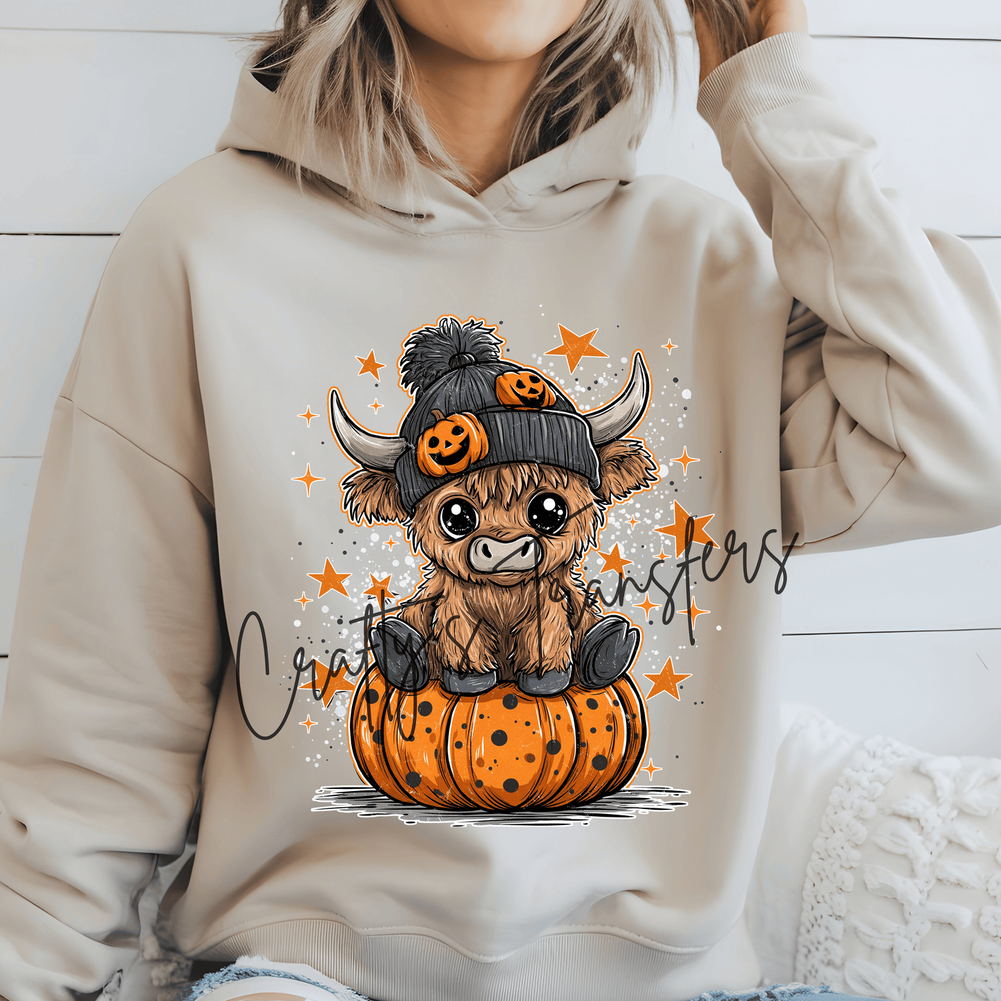 Highland Cow in Black Stocking Cap on Pumpkin